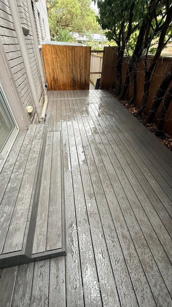 Composite deck replacement Summer Hill Sydney — charcoal grey composite decking with built-in steps