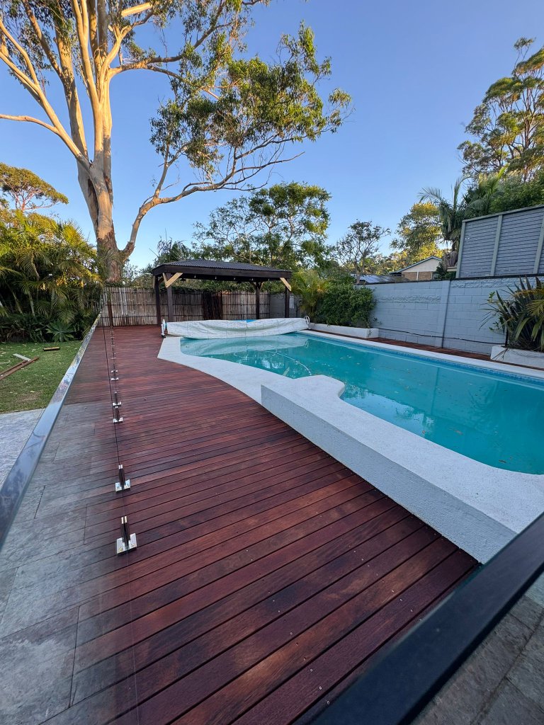 Merbau pool deck with glass balustrade blue sky - Wahroonga Upper North Shore