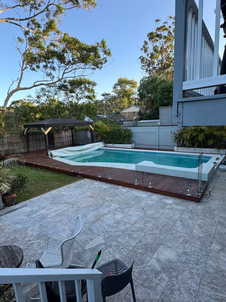 Merbau pool deck with frameless glass fence and pergola - Wahroonga Sydney
