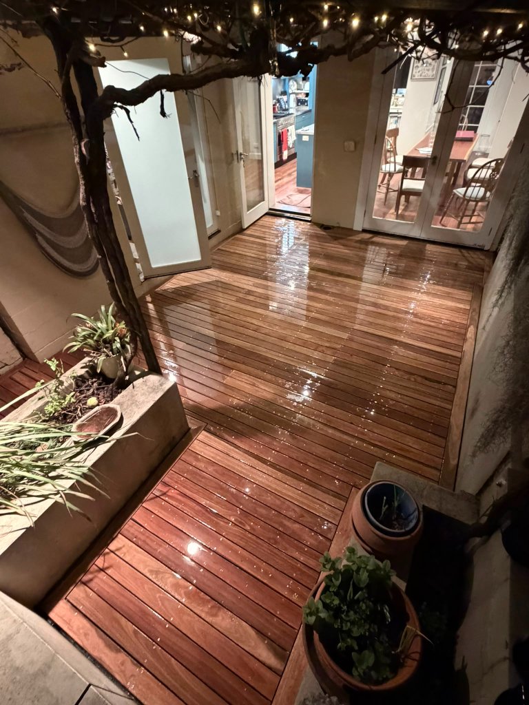 Spotted Gum courtyard deck in Surry Hills at night with garden lighting