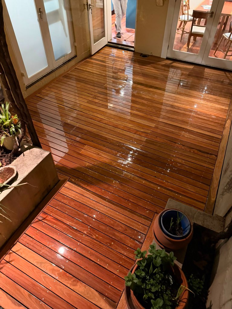 Spotted Gum deck boards glowing under garden string lights