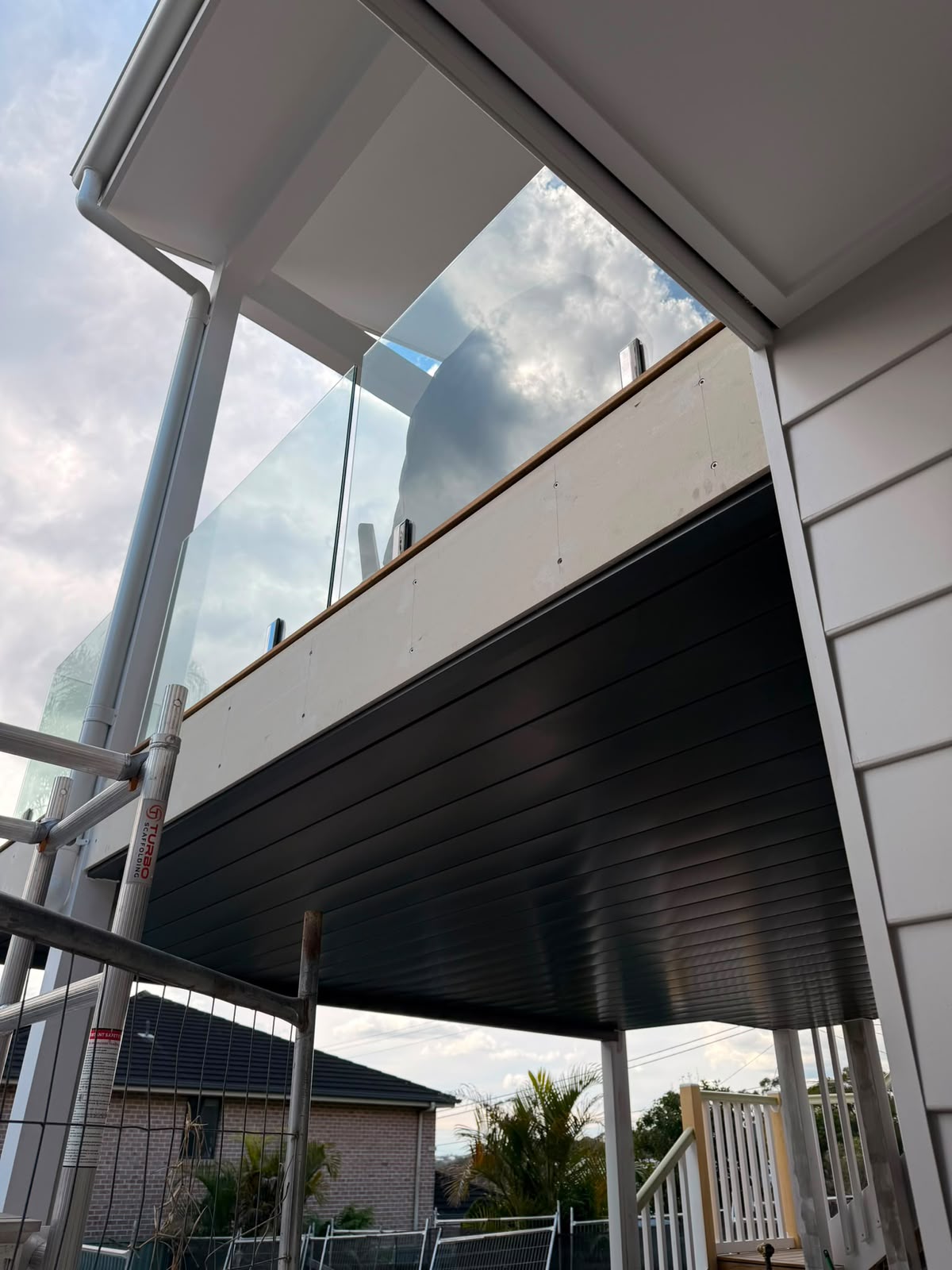 Staircase under construction with soffit lining above