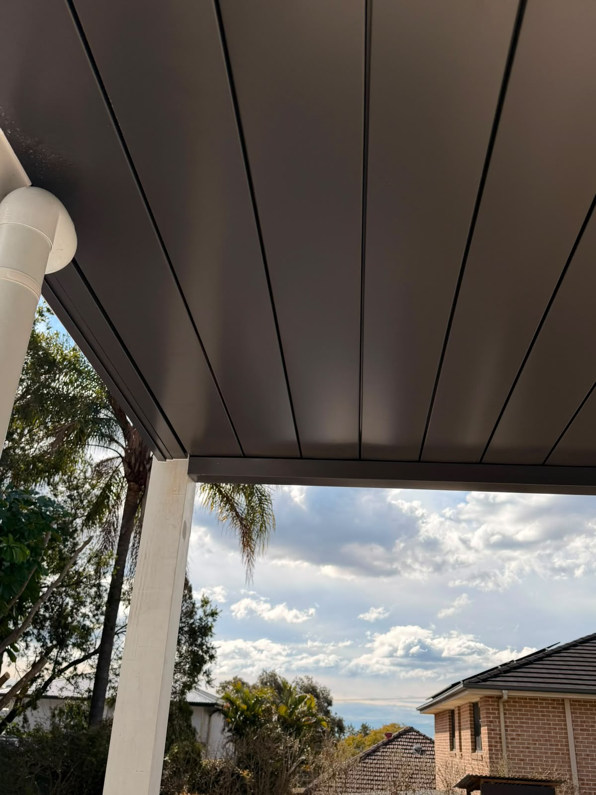 Corner detail showing mitred edge where soffit meets balcony frame